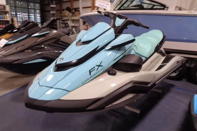 Slide: The Image of 2025 Yamaha WaveRunner FX Cruiser HO in showroom, light blue and black design. - 4