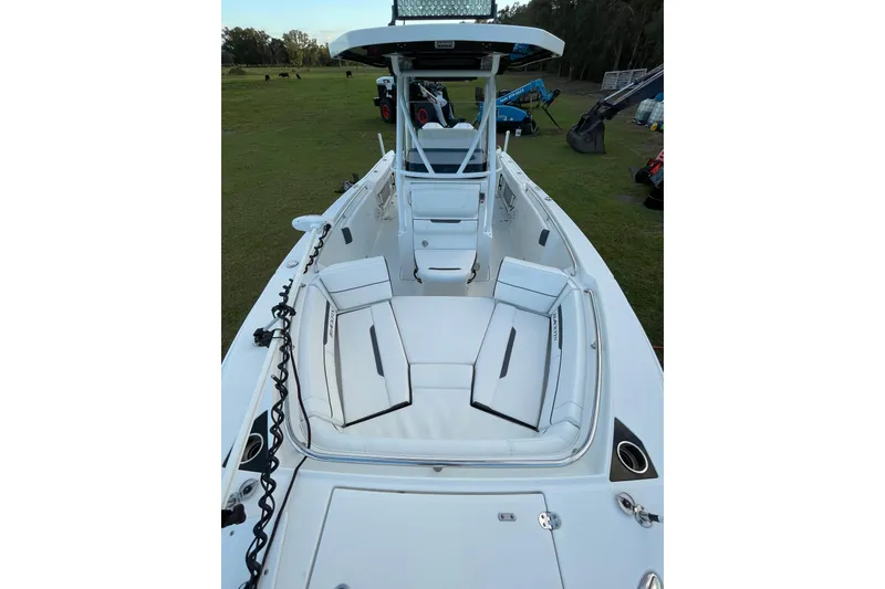 Slide: The Image of 2022 Blackfin 252 CC boat with spacious seating and modern design. - 11