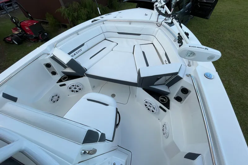 Slide: The Image of 2022 Blackfin 252 CC boat interior with white seating and modern amenities. - 13