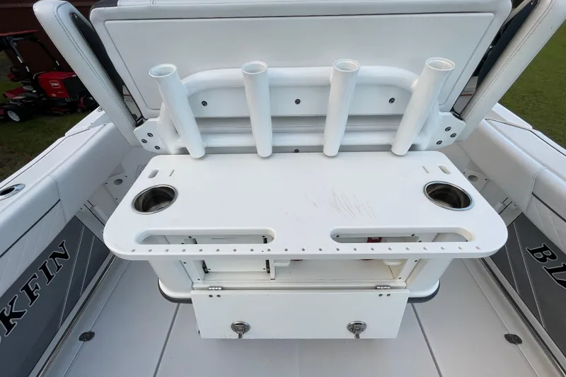 Slide: The Image of 2022 Blackfin 252 CC boat with rod holders and storage compartment. - 24