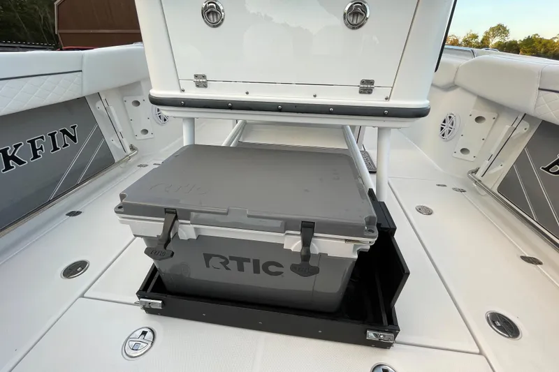 Slide: The Image of 2022 Blackfin 252 CC boat interior with RTIC cooler storage. - 26