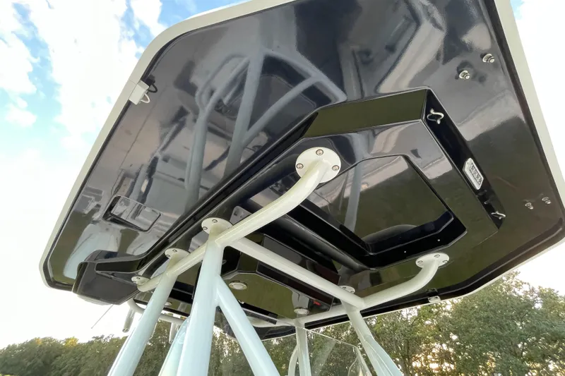 Slide: The Image of 2022 Blackfin 252 CC boat's T-top structure, showcasing sleek design and sturdy construction. - 27
