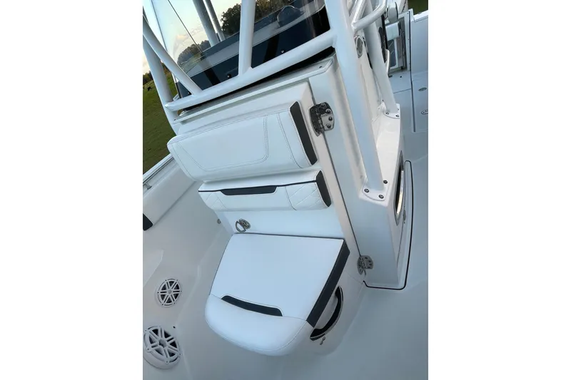 Slide: The Image of 2022 Blackfin 252 CC boat interior with white seating and storage compartments. - 35