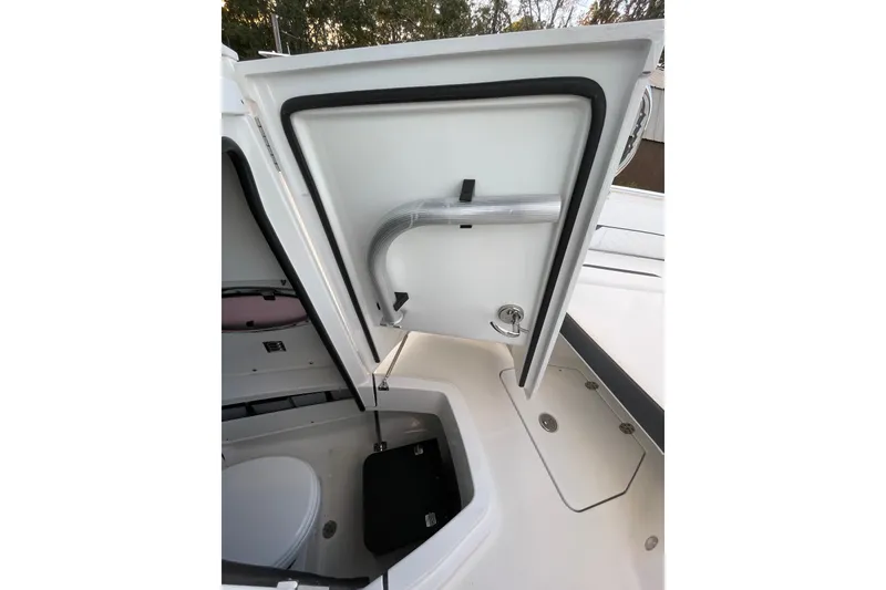 Slide: The Image of Open storage compartment on 2022 Blackfin 252 CC boat, showcasing interior details. - 37