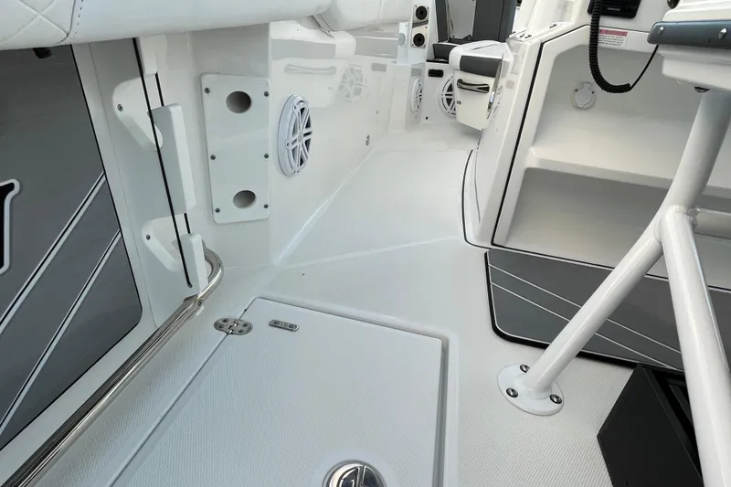 Slide: The Image of 2022 Blackfin 252 CC boat interior, featuring sleek white design and modern amenities. - 47
