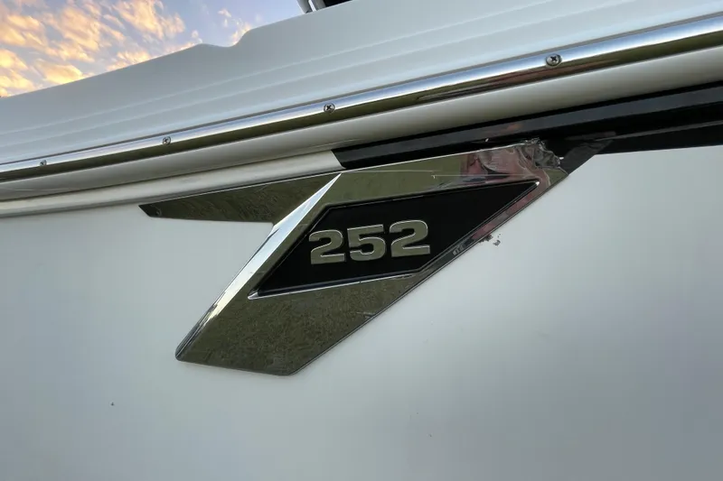 Slide: The Image of 2022 Blackfin 252 CC boat emblem with chrome detailing. - 7