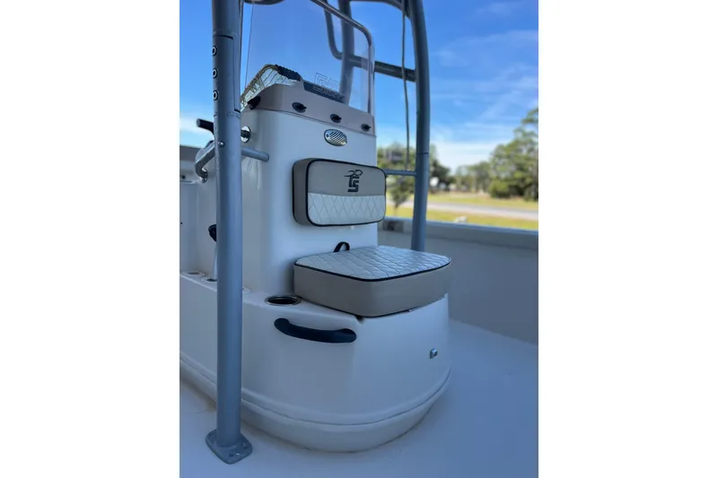 Slide: The Image of 2020 Carolina Skiff 21 LS boat interior with cushioned seating and console. - 12