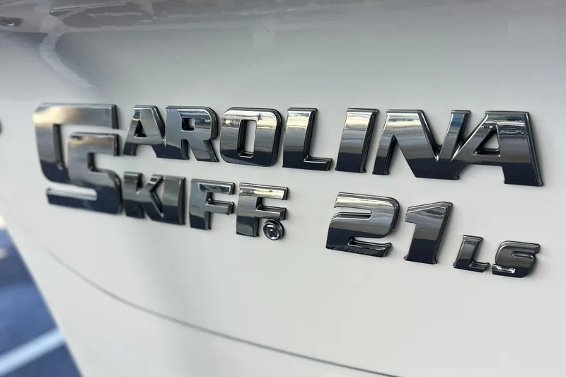 Slide: The Image of 2020 Carolina Skiff 21 LS logo on white surface, chrome lettering. - 5