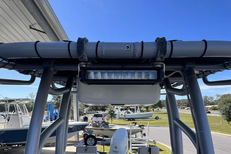 Slide: The Image of 2020 Carolina Skiff 21 LS boat with T-top and LED light, parked outdoors. - 6