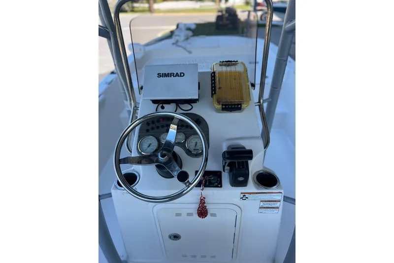 Slide: The Image of 2020 Carolina Skiff 21 LS boat console with steering wheel and Simrad navigation system. - 8