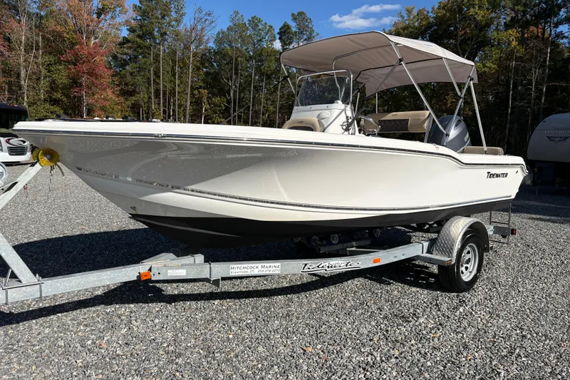 The Image of 2022 Tidewater 180 CC Adventure boat on trailer, parked outdoors. - 0