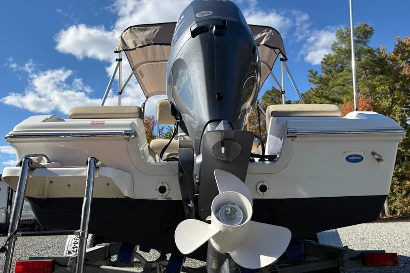 Slide: The Image of 2022 Tidewater 180 CC Adventure boat with outboard motor, viewed from the rear. - 2