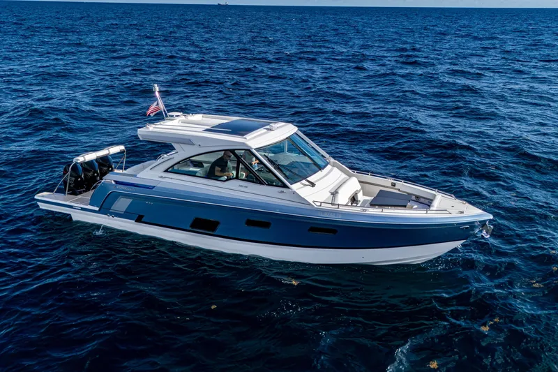 The Image of 2022 Formula 380 Super Sport Crossover OB cruising on open ocean waters. - 0