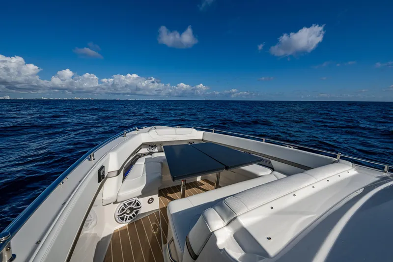 Slide: The Image of 2022 Formula 380 Super Sport Crossover OB on open ocean under clear blue sky. - 12