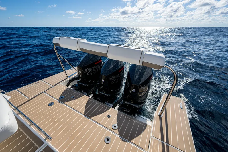 Slide: The Image of 2022 Formula 380 Super Sport Crossover OB with twin outboard engines on open sea. - 16