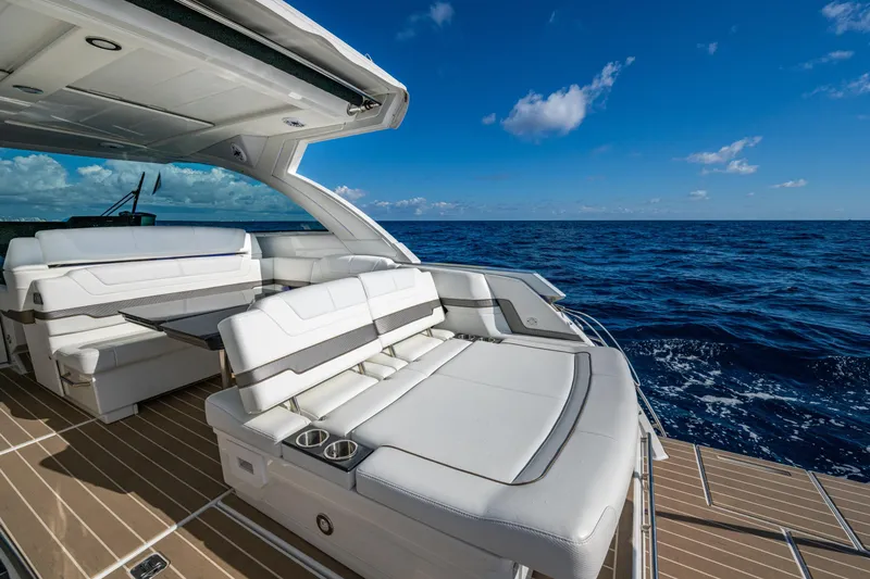 Slide: The Image of 2022 Formula 380 Super Sport Crossover OB yacht with luxurious seating on open sea. - 17