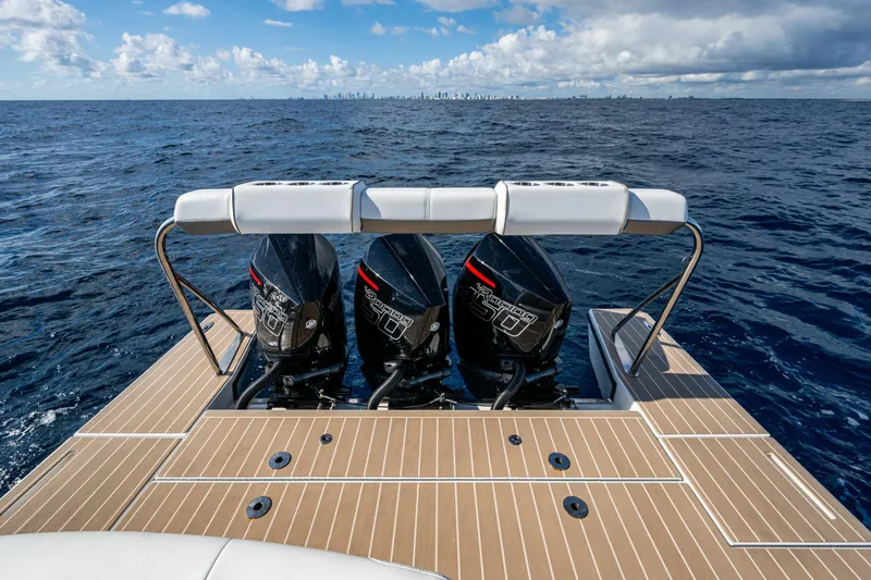 Slide: The Image of 2022 Formula 380 Super Sport Crossover OB with triple outboard engines on open sea. - 25