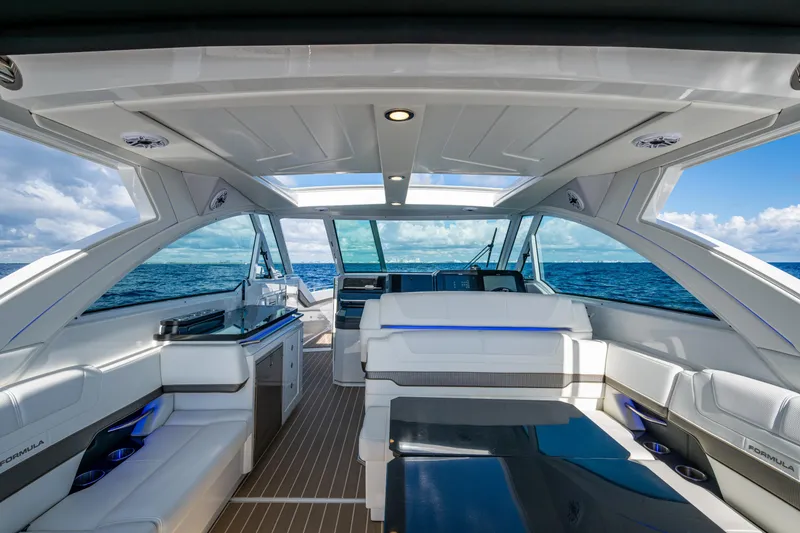 Slide: The Image of 2022 Formula 380 Super Sport Crossover OB interior with ocean view, featuring sleek design and modern amenities. - 33