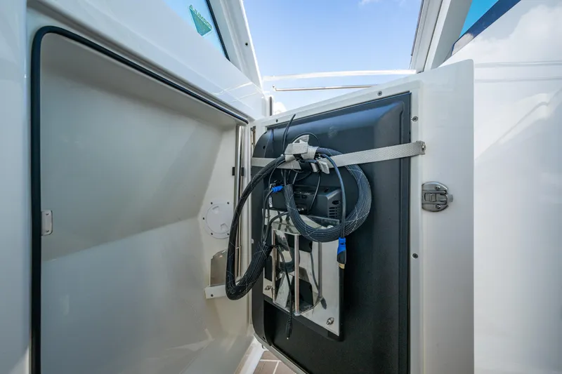 Slide: The Image of 2022 Formula 380 Super Sport Crossover OB storage compartment with cables and equipment. - 41