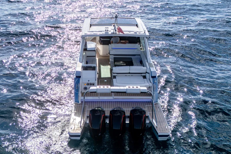 Slide: The Image of 2022 Formula 380 Super Sport Crossover OB cruising on sparkling blue water. - 47