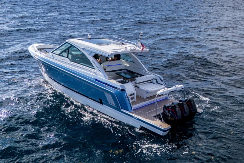 Slide: The Image of 2022 Formula 380 Super Sport Crossover OB cruising on open water. - 49