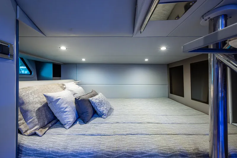 Slide: The Image of Luxurious cabin interior of 2022 Formula 380 Super Sport Crossover OB with plush bedding. - 5