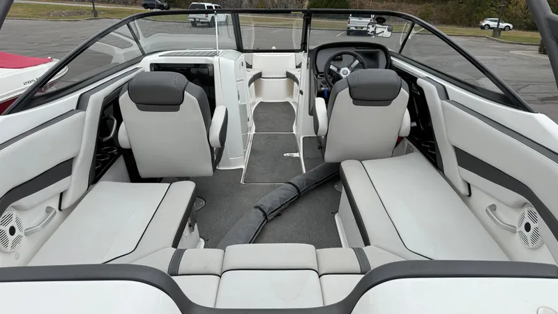 Slide: The Image of 2019 Yamaha Boats AR240 interior with sleek seating and modern dashboard design. - 3