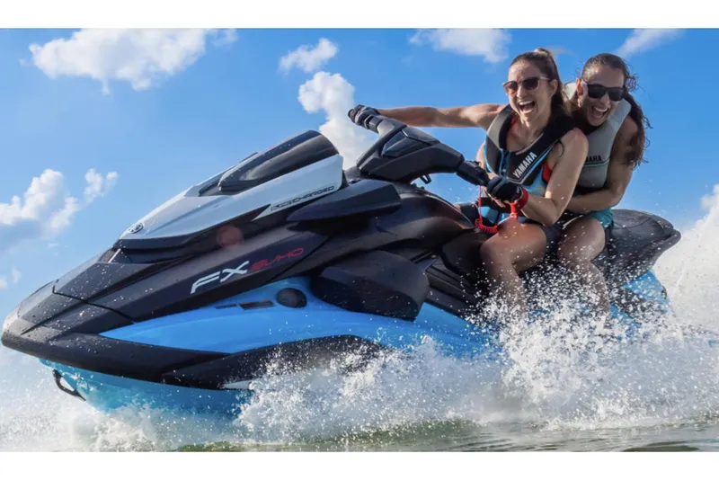 Slide: The Image of 2025 Yamaha WaveRunner FX SVHO in showroom, blue and black design. - 2