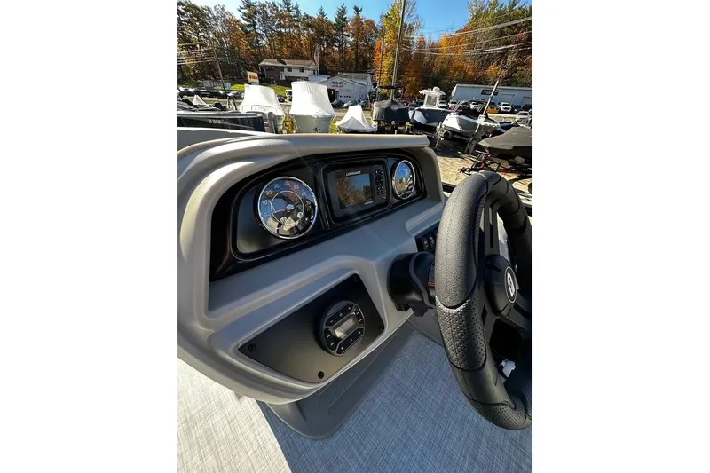 Slide: The Image of Steering console of 2026 DOCKSIDE 20DQ boat with gauges and controls. - 10