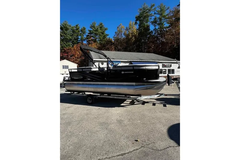 Slide: The Image of 2026 DOCKSIDE 20DQ pontoon boat on trailer, parked outdoors. - 5