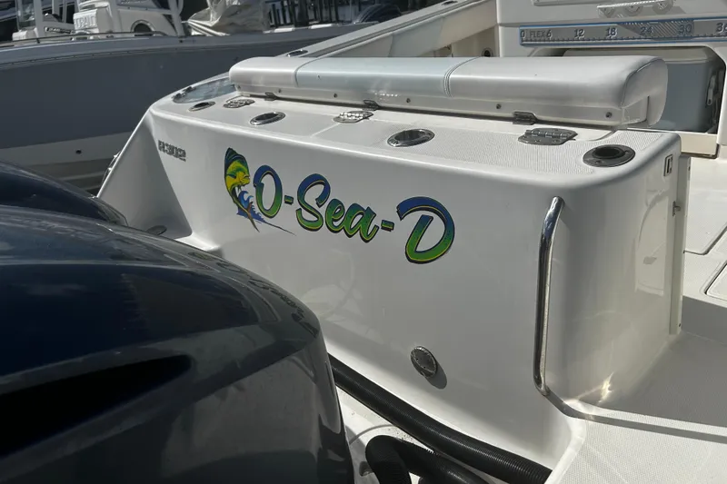 Slide: The Image of 2018 Robalo R302 Center Console boat with custom "O-Sea-D" graphics. - 9
