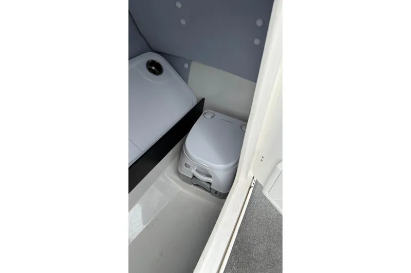 Slide: The Image of 2019 Yamaha Boats AR240 interior with compact marine toilet. - 13