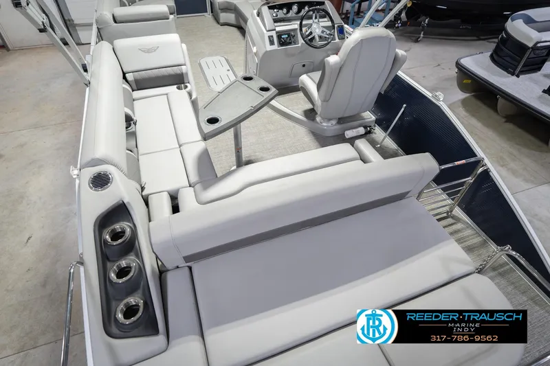 Slide: The Image of 2024 Bennington 23 LSB pontoon boat interior with luxurious seating and modern helm. - 15