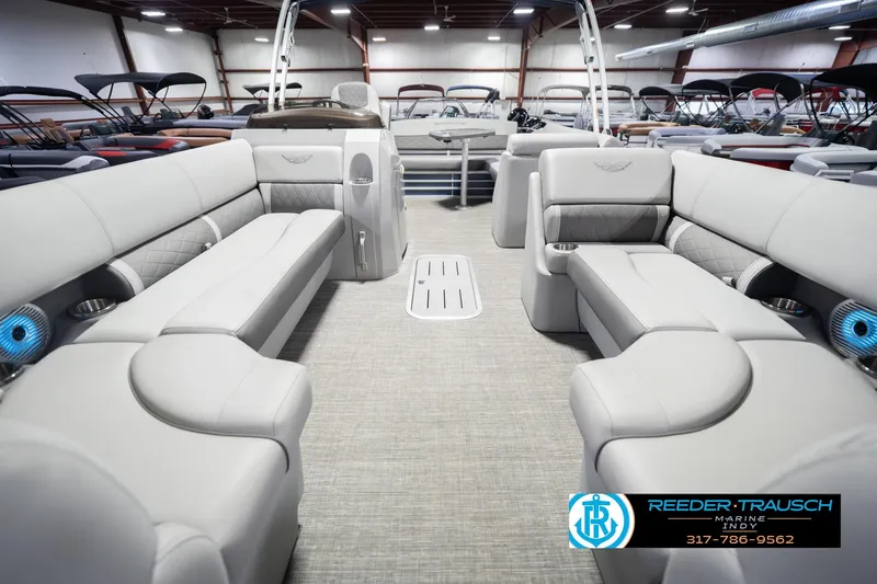 Slide: The Image of 2024 Bennington 23 LSB pontoon boat interior with luxurious seating and modern design. - 16