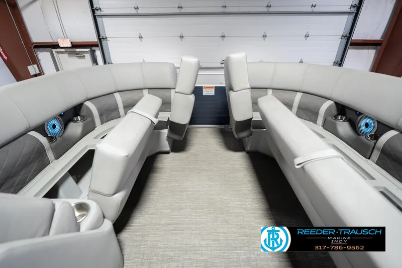 Slide: The Image of 2024 Bennington 23 LSB pontoon boat interior with luxurious seating and modern design. - 22