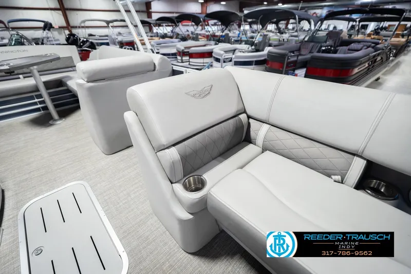 Slide: The Image of 2024 Bennington 23 LSB pontoon boat interior with luxurious seating and cup holders. - 23