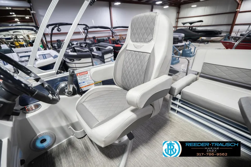 Slide: The Image of 2024 Bennington 23 LSB boat interior with luxurious captain's chair and modern design. - 26