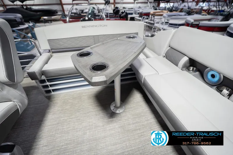 Slide: The Image of 2024 Bennington 23 LSB boat interior with seating and table, showcased by Reeder Trausch Marine. - 27