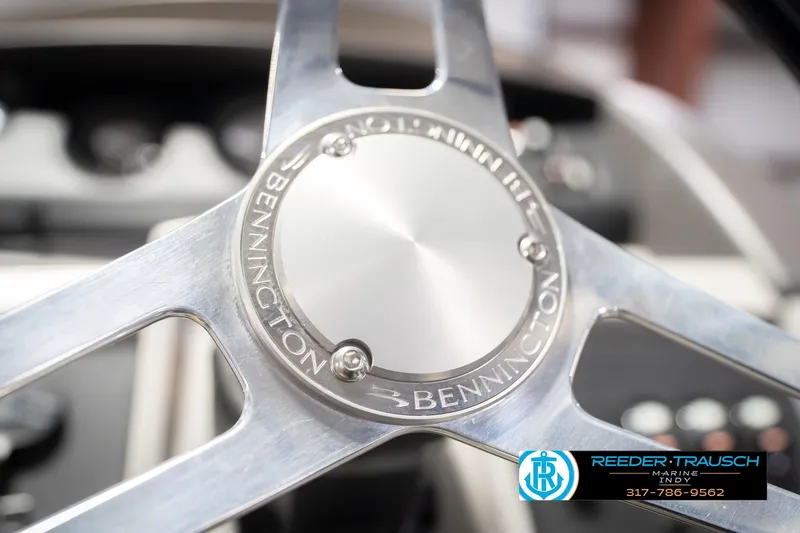 Slide: The Image of Close-up of 2024 Bennington 23 LSB steering wheel with Reeder-Trausch Marine logo. - 34