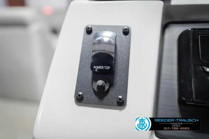 Slide: The Image of Power top switch on 2024 Bennington 23 LSB boat dashboard, Reeder-Trausch Marine logo visible. - 35