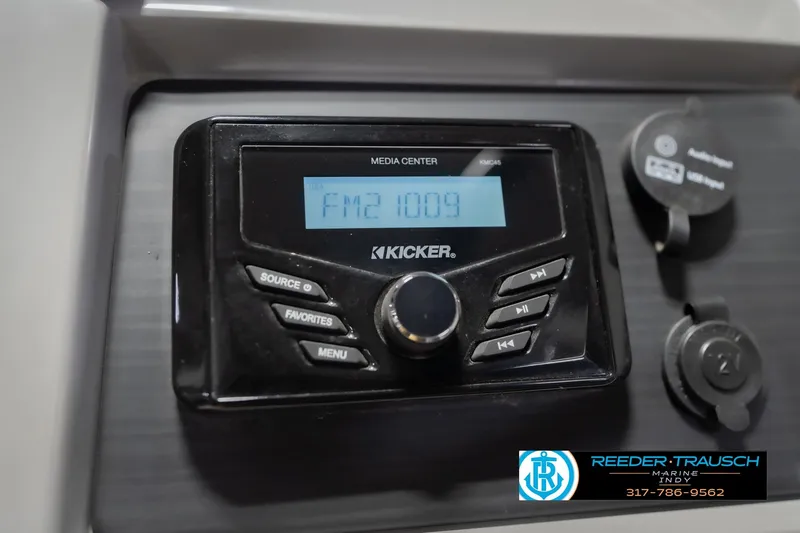 Slide: The Image of Kicker media center in 2024 Bennington 23 LSB boat dashboard, displaying FM 100.9. - 36