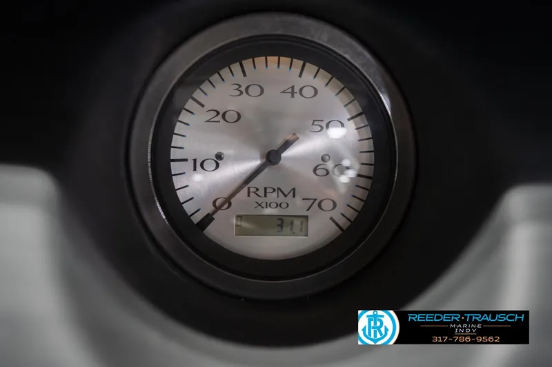 Slide: The Image of Tachometer of 2024 Bennington 23 LSB boat displaying RPM with Reeder-Trausch Marine logo. - 39