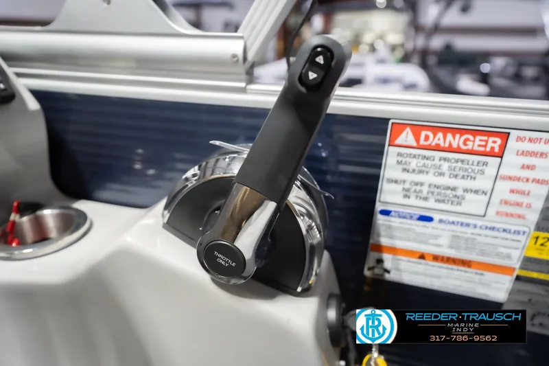 Slide: The Image of Throttle control of 2024 Bennington 23 LSB boat with safety warning label. - 44