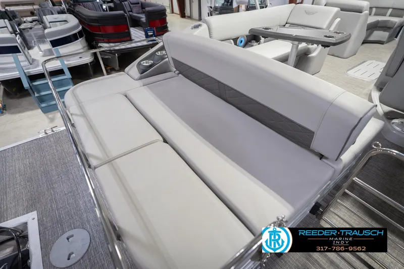 Slide: The Image of 2024 Bennington 23 LSB pontoon boat interior with plush seating and modern design. - 48