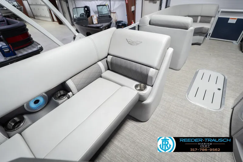 Slide: The Image of 2024 Bennington 23 LSB boat interior with luxurious seating and cup holders. - 49