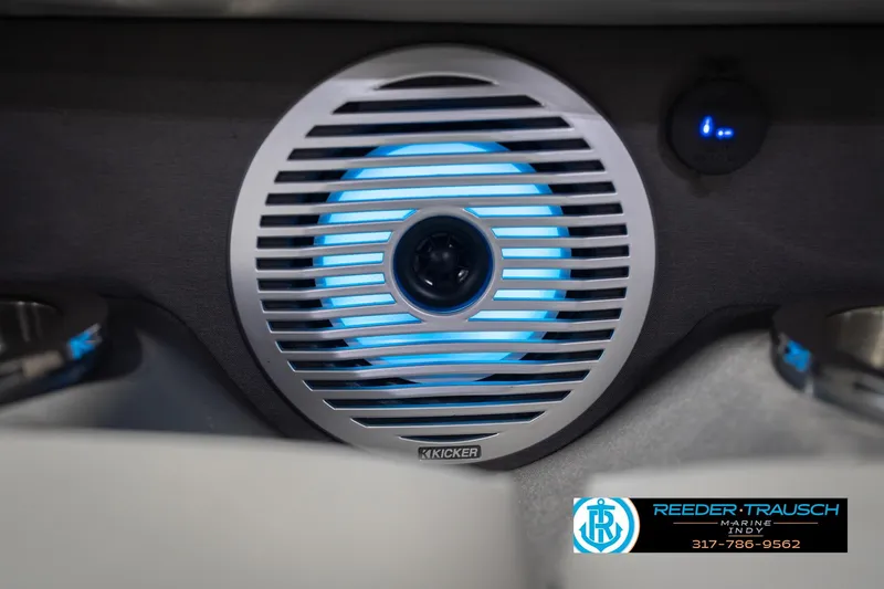 Slide: The Image of Illuminated speaker on 2024 Bennington 23 LSB boat, featuring blue LED lighting. - 51