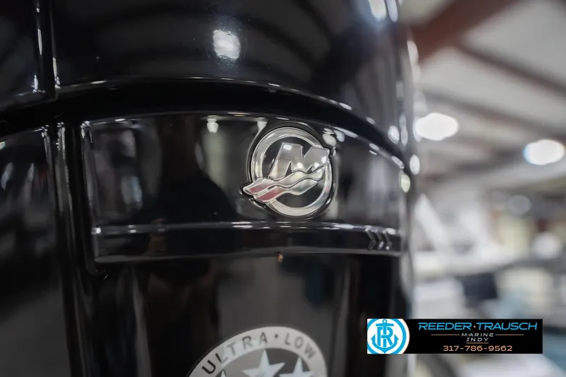 Slide: The Image of 2024 Bennington 23 LSB boat detail with logo in showroom setting. - 57