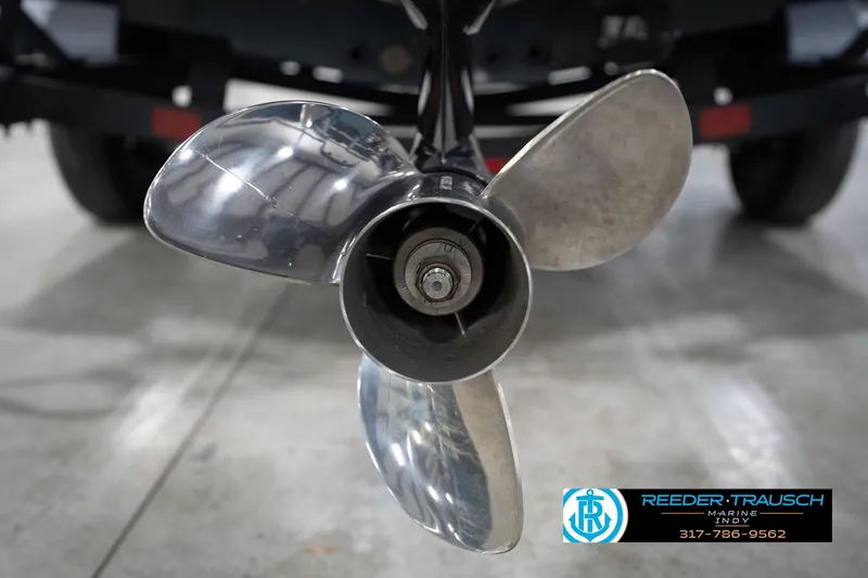 Slide: The Image of Close-up of a 2024 Bennington 23 LSB boat propeller in a showroom. - 59