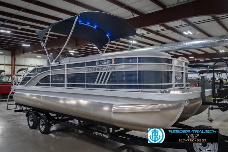 Slide: The Image of 2024 Bennington 23 LSB pontoon boat with canopy in indoor showroom. - 6