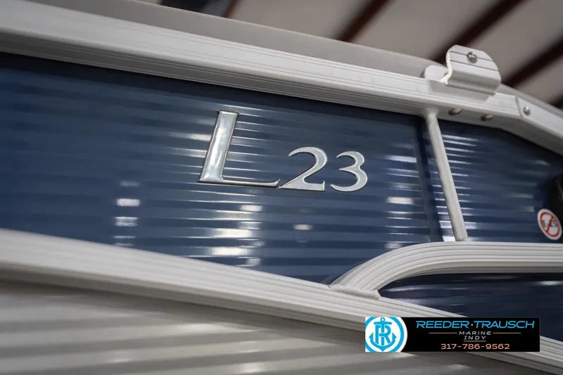 Slide: The Image of 2024 Bennington 23 LSB boat with blue exterior and silver lettering. - 62